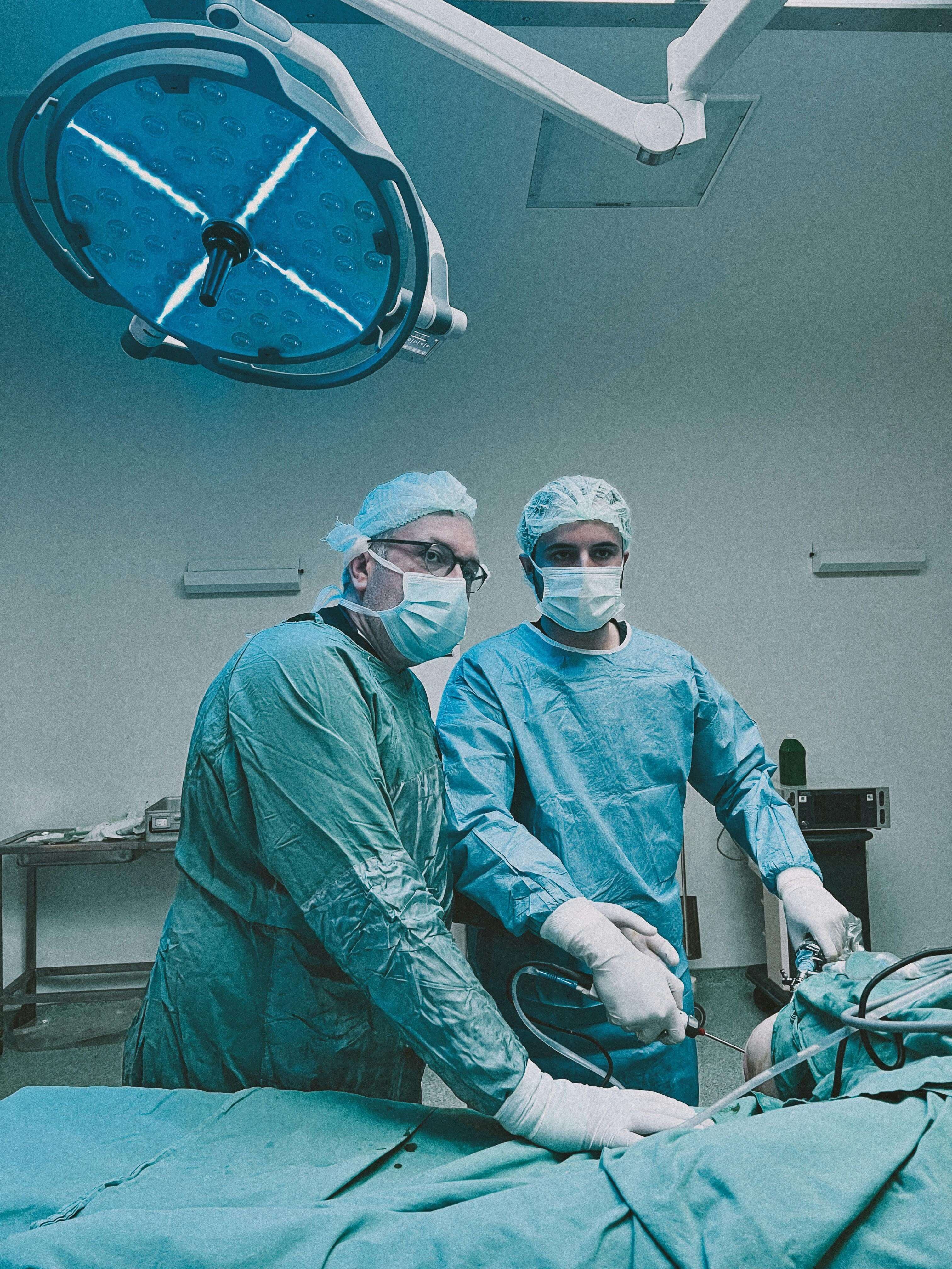 picture of two doctors carrying out a surgery